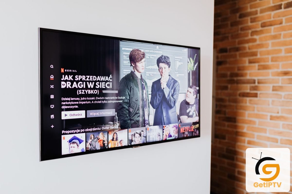 Real photo of a flat-screen television mounted in a modern living room; GetIPTV logo added